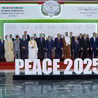 US President Donald Trump (C) and other world leaders pose for a group photograph at the Sharm El-Sheikh Peace Summit in the Egyptian Red Sea resort town of Sharm el-Sheikh on October 13, 2025. (Evan Vucci / POOL / AFP)