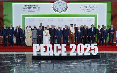 US President Donald Trump (C) and other world leaders pose for a group photograph at the Sharm El-Sheikh Peace Summit in the Egyptian Red Sea resort town of Sharm el-Sheikh on October 13, 2025. (Evan Vucci / POOL / AFP)