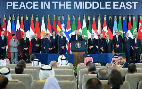 US President Donald Trump (C) speaks during the Sharm El-Sheikh Peace Summit in the Egyptian Red Sea resort town of Sharm el-Sheikh on October 13, 2025. (Photo by SAUL LOEB / AFP)