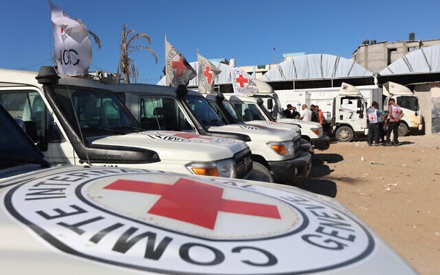 Red Crescent vehicles and refrigerated trucks are parked at the Nasser hospital in Khan Younis in the southern Gaza Strip on October 15, 2025, (Omar Al-Qattaa/AFP)