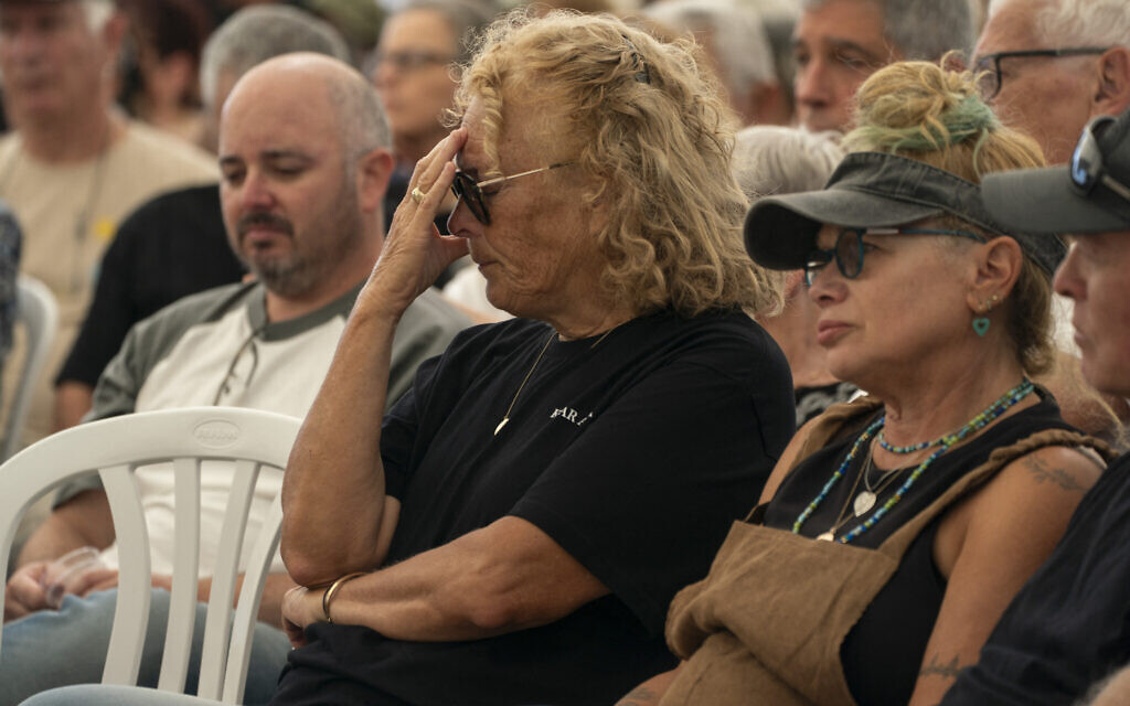 Members of the Kfar Aza kibbutz hold a memorial service for those killed in Hamas's October 7, 2023 attack on Israel, in Kibbutz Kfar Aza on October 16, 2025. (Maya Levin / AFP)