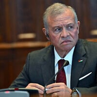 Jordan's King Abdullah II looks on during a reception by the deputy speaker of the Hungarian Parliament at the Hungarian Parliament building in Budapest on October 16, 2025 (Attila KISBENEDEK / AFP)