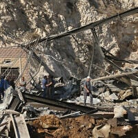 People inspect the damage after a series of Israeli airstrikes in the southern Lebanese village of Ansar on October 17, 2025. (MAHMOUD ZAYYAT / AFP)
