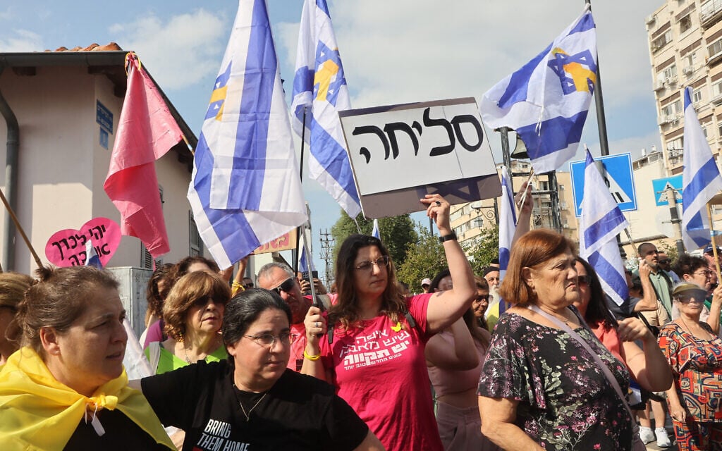 Mourners wait for the convoy carrying the coffin of Inbar Haiman, who was killed during the October 7, 2023, massacre at the Nova music festival and her body taken to Gaza, during her funeral in Rishon Lezion, on October 17, 2025. (Gil Cohen-Magen/AFP)