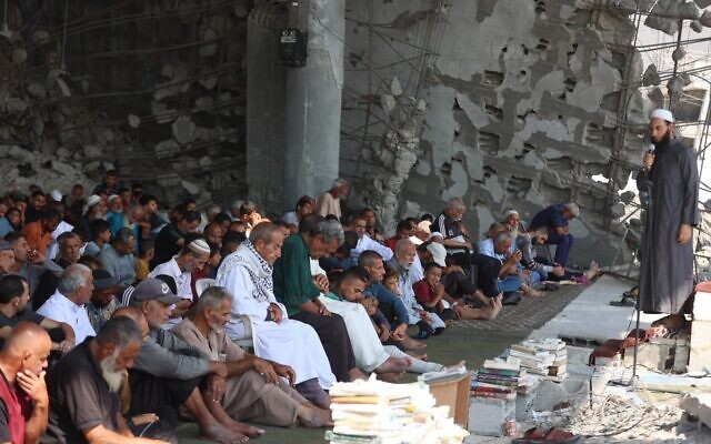 Gazans attend Friday prayers amidst the rubble of the destroyed Albaani Mosque in Khan Yunis in the southern Gaza Strip on October 17, 2025. (Omar AL-Qatta / AFP) Gazans attend Friday prayers amidst the rubble of the destroyed Albaani Mosque in Khan Yunis in the southern Gaza Strip on October 17, 2025. (Omar AL-Qatta / AFP)