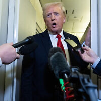 US President Donald Trump speaks with the media aboard Air Force One prior to landing at Joint Base Andrews in Maryland, October 19, 2025, as he returns from West Palm Beach, Florida, after spending the weekend at Mar-a-Lago. (SAUL LOEB / AFP)