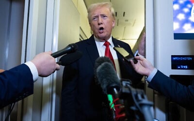 US President Donald Trump speaks with the media aboard Air Force One prior to landing at Joint Base Andrews in Maryland, October 19, 2025, as he returns from West Palm Beach, Florida, after spending the weekend at Mar-a-Lago. (SAUL LOEB / AFP)