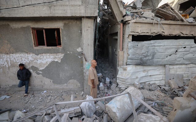 A Palestinian man inspects the damage around his home in the Bureij camp in the central Gaza Strip on October 20, 2025 (Eyad BABA / AFP) A Palestinian man inspects the damage around his home in the Bureij camp in the central Gaza Strip on October 20, 2025 (Eyad BABA / AFP)