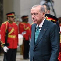 This handout photograph taken and released by Turkish Presidency Press Office on October 21, 2025, shows Turkey's President Recep Tayyip Erdogan during a welcoming ceremony in Kuwait City (Handout / Turkish Presidency Press Office / AFP)