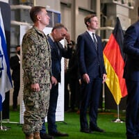 US special envoy Steve Witkof (2nd-L) reacts while Jared Kushner (C) and CENTCOM Commander Adm. Brad Cooper (L) look on as US Vice President JD Vance speaks during a press conference, following a military briefing at the Civil-Military Coordination Center in southern Israel on October 21, 2025. (Nathan Howard/Pool/AFP)