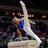 Brazil's Caio Souza competes on the pommel horse during the men's all-around final at the 53rd FIG Artistic Gymnastics World Championships in Jakarta, Indonesia, on October 22, 2025. (BAY ISMOYO / AFP)