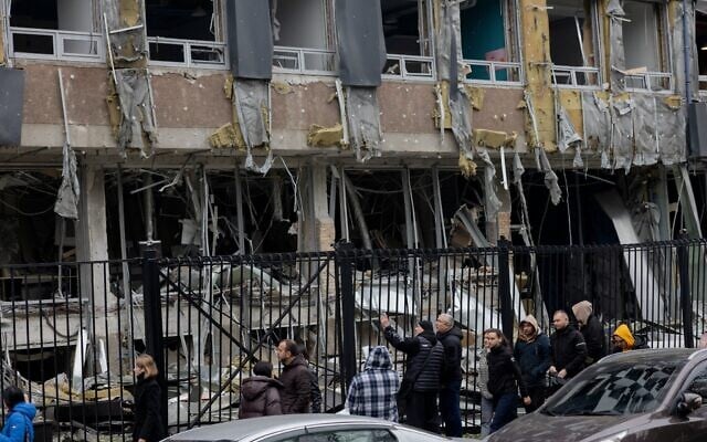 Residents walk near a damaged business center following a drone attack in Kyiv, on October 23, 2025, amid the Russian invasion of Ukraine. (Tetiana DZHAFAROVA / AFP) Residents walk near a damaged business center following a drone attack in Kyiv, on October 23, 2025, amid the Russian invasion of Ukraine. (Tetiana DZHAFAROVA / AFP)