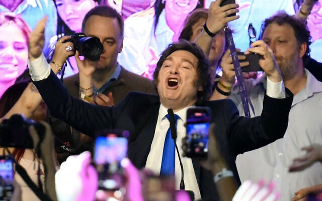 Argentina's President Javier Milei celebrates at the ruling party's La Libertad Avanza headquarters following the results of the national midterm legislative election in Buenos Aires on October 26, 2025. (Luis ROBAYO / AFP)