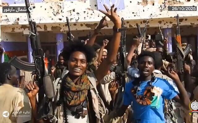RSF fighters holding weapons and celebrating in the streets of El-Fasher in Sudan's Darfur region, in a screengrab of a video published on Telegram, on October 26, 2025. (Rapid Support Forces / AFP) RSF fighters holding weapons and celebrating in the streets of El-Fasher in Sudan's Darfur region, in a screengrab of a video published on Telegram, on October 26, 2025. (Rapid Support Forces / AFP)