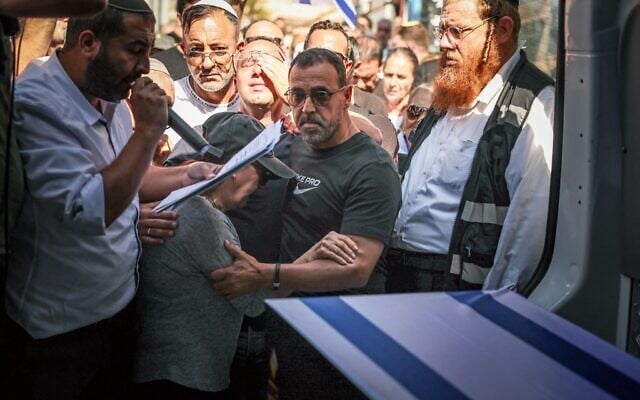 Former hostage Eli Sharabi takes part in the funeral procession of brother Yossi Sharabi, who was killed in captivity after being taken hostage during the October 7, 2023 attacks, in the central city of Rishon Letzion on October 27, 2025 (FADEL SENNA / AFP) Former hostage Eli Sharabi takes part in the funeral procession of brother Yossi Sharabi, who was killed in captivity after being taken hostage during the October 7, 2023 attacks, in the central city of Rishon Letzion on October 27, 2025 (FADEL SENNA / AFP)