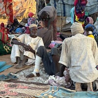 Displaced Sudanese who fled El-Fasher after the city fell to the Rapid Support Forces (RSF), rest near the town of Tawila in war-torn Sudan's western Darfur region on October 28, 2025. (AFP)