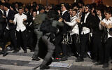 Police clash with ultra-Orthodox Jewish men during a protest against conscription to the IDF, in Jerusalem on October 30, 2025. (Fadel SENNA / AFP)