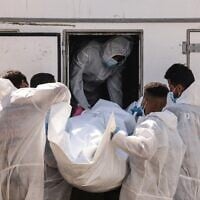 Employees of the Nasser Medical Complex unload one of the thirty bodies of  Palestinians released as part of the hostage-ceasefire deal, as the body bags arrive in Khan Yunis, in the southern Gaza Strip, on October 31, 2025. (Photo by AFP)