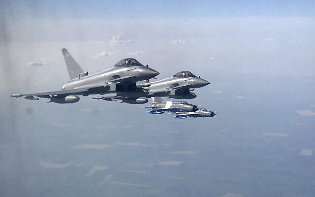 Royal Air Force Eurofighter Typhoon fighter jets escort a transport plane in eastern Romania, April 27, 2018. (Vadim Ghirda/AP) Royal Air Force Eurofighter Typhoon fighter jets escort a transport plane in eastern Romania, April 27, 2018. (Vadim Ghirda/AP)
