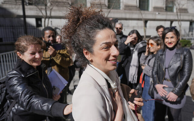 Masih Alinejad greets friends and supporters outside the federal courthouse after testifying at the trial of two men accused of allegedly plotting to kill her in New York, March 18, 2025. (AP/Seth Wenig) Masih Alinejad greets friends and supporters outside the federal courthouse after testifying at the trial of two men accused of allegedly plotting to kill her in New York, March 18, 2025. (AP/Seth Wenig)