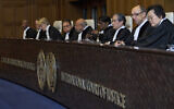 Presiding judge Yuji Iwasawa, third right, opens the International Court of Justice hearings into a United Nations request for an advisory opinion on Israel's obligations to allow humanitarian assistance in Gaza and the West Bank, in The Hague, Netherlands, April 28, 2025. (AP Photo/Peter Dejong)