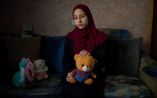 Tayma Asous, 26, holds the favorite toy of her 2-year-old daughter, Layla Al-Khatib, who was killed after being shot in the head by alleged Israeli gunfire, at their home in the village of Muthallath ash-Shuhada, near the West Bank city of Jenin, March 11, 2025. (AP Photo/Leo Correa) Tayma Asous, 26, holds the favorite toy of her 2-year-old daughter, Layla Al-Khatib, who was killed after being shot in the head by alleged Israeli gunfire, at their home in the village of Muthallath ash-Shuhada, near the West Bank city of Jenin, March 11, 2025. (AP Photo/Leo Correa)