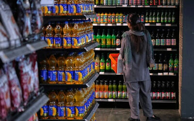 A customer shops in a supermarket at a shopping mall in northern Tehran, Iran, September 28, 2025. (AP Photo/Vahid Salemi) A customer shops in a supermarket at a shopping mall in northern Tehran, Iran, September 28, 2025. (AP Photo/Vahid Salemi)