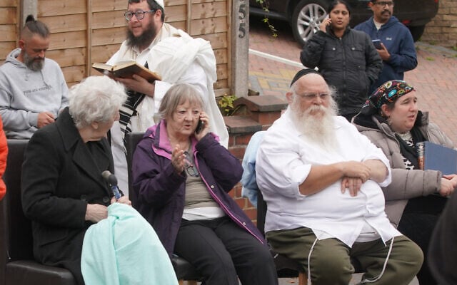 Congregants seen outside Heaton Park Hebrew Congregation synagogue, in Crumpsall, Manchester, England, after a deadly terrorist attack, Oct. 2, 2025. (AP Photo/Ian Hodgson)