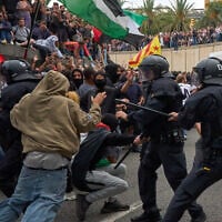 Police clash with pro-Palestinian, anti-Israel demonstrators during a protest in Barcelona, Spain, on October 2, 2025, in solidarity with the Global Sumud Flotilla after ships were intercepted by the Israeli navy. (AP/Emilio Morenatti)