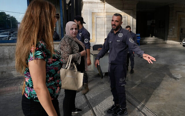 A Syrian policeman checks women at the entrance of Latakia's Governor building where the voting for a parliamentary election is taking place, in the costal city of Latakia, Syria, Sunday, Oct. 5, 2025. (AP/Hussein Malla) A Syrian policeman checks women at the entrance of Latakia's Governor building where the voting for a parliamentary election is taking place, in the costal city of Latakia, Syria, Sunday, Oct. 5, 2025. (AP/Hussein Malla)