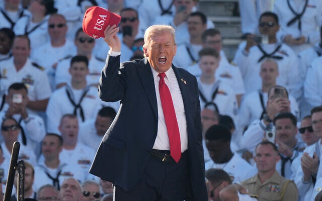 US President Donald Trump arrives to speak during a celebration for the 250th anniversary of the US Navy aboard the USS Harry S. Truman at Naval Station Norfolk, October 5, 2025 in Norfolk, Virginia. (AP Photo/Steve Helber)
