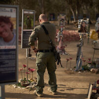 A soldier visits the site of the Nova music festival where revelers were killed and kidnapped during the October 7, 2023, Hamas-led attack. near Kibbutz Re'im in southern Israel, October 6, 2025. (AP Photo/Leo Correa)