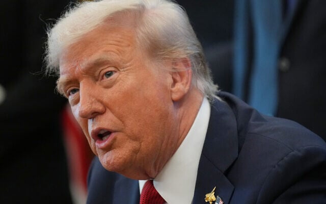 US President Donald Trump speaks to reporters before signing an executive order in the Oval Office at the White House, October 6, 2025, in Washington. (AP Photo/Jacquelyn Martin)