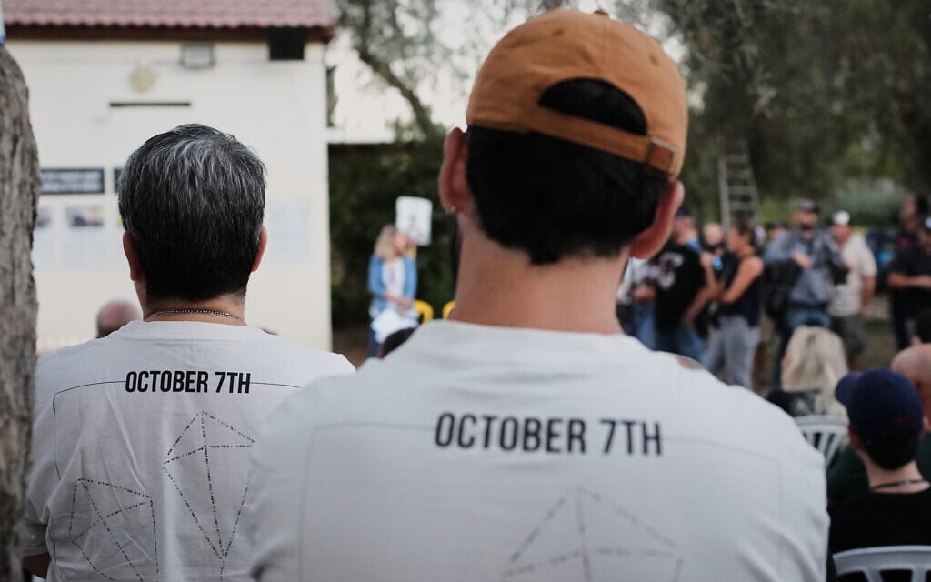People attend a memorial service marking two years since the October 7, 2023, Hamas cross-border attack on Israel, in Kibbutz Kfar Aza, southern Israel where many community members were killed and abducted,  October 7, 2025. (AP Photo/Ohad Zwigenberg)