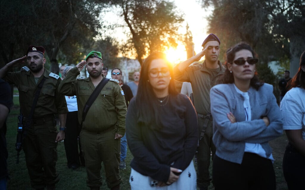 People attend a memorial service marking two years since the Oct. 7, 2023, Hamas cross-border attack on Israel, in Kibbutz Kfar Aza, southern Israel where many of its community members were Killed and abducted, Oct. 7, 2025. (AP Photo/Ohad Zwigenberg)