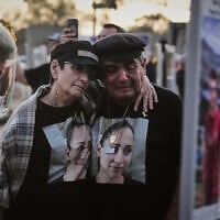 The parents of Shiran Slavin visit the site of the Nova music festival near Kibbutz Reim in southern Israel, where she and hundreds of others were killed and abducted during the deadly Hamas cross-border attack on Oct. 7, 2023, as Israel marks the second anniversary of the attack, Oct. 7, 2025. (AP Photo/Ariel Schalit)