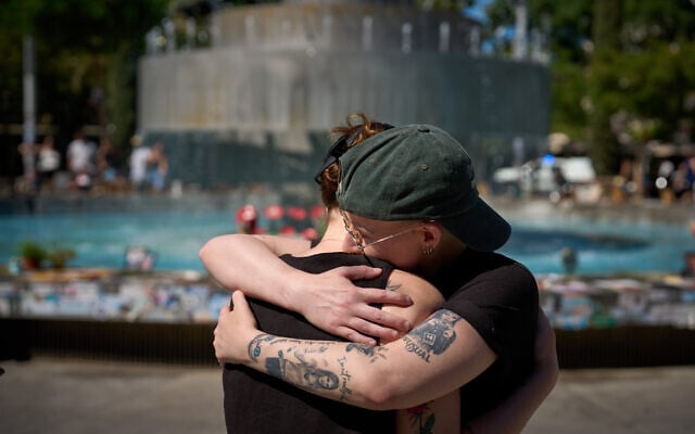 People embrace at a memorial marking the second anniversary of the Hamas onslaught of October 7, 2023, at Tel Aviv's Dizengoff Square, October 7, 2025. (AP Photo/Emilio Morenatti) People embrace at a memorial marking the second anniversary of the Hamas onslaught of October 7, 2023, at Tel Aviv's Dizengoff Square, October 7, 2025. (AP Photo/Emilio Morenatti)