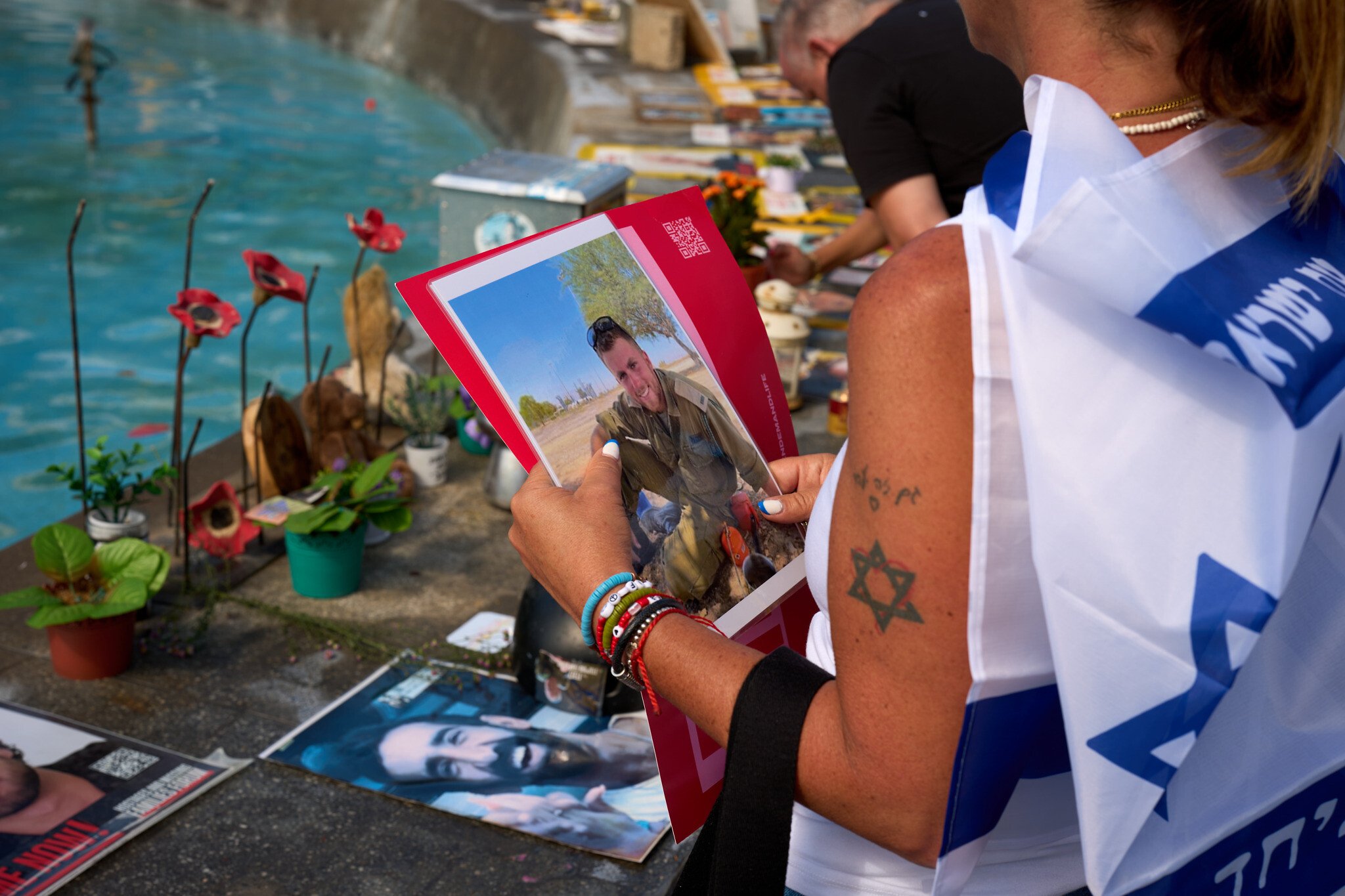 NextImg:In grassroots initiative, Israelis scrub Oct. 7 memorial, reframe photos of those killed