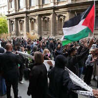 Students march and wave Palestinian flags during an anti-Israel inter-university march in London on the second anniversary of the Hamas onslaught that sparked the war in Gaza, October 7, 2025. (AP Photo/Kin Cheung)