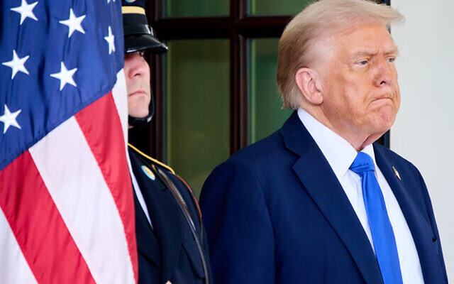 US President Donald Trump waits to greet Canada's Prime Minister Mark Carney, as Carney arrives at the White House, October 7, 2025, in Washington. (AP Photo/Jacquelyn Martin)