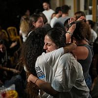 Relatives and supporters of hostages held by Hamas in the Gaza Strip celebrate after the announcement that Israel and Hamas have agreed to the first phase of a plan releasing the hostages and ending war in Gaza, in Hostages Square in Tel Aviv, October 9, 2025. (AP/Emilio Morenatti)