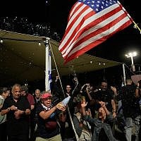 Freed captives, relatives of hostages  and their supporters celebrate after the announcement that Israel and Hamas have agreed to the first phase of Gaza ceasefire plan, as they gather at Hostages Square in Tel Aviv, October 9, 2025. (AP/Ohad Zwigenberg)