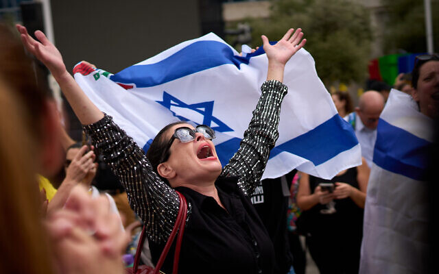 People react as they celebrate following the announcement that Israel and Hamas have agreed to the first phase of a peace plan to pause the fighting, at Hostages Square in Tel Aviv, Oct. 9, 2025. (AP Photo/Emilio Morenatti) People react as they celebrate following the announcement that Israel and Hamas have agreed to the first phase of a peace plan to pause the fighting, at Hostages Square in Tel Aviv, Oct. 9, 2025. (AP Photo/Emilio Morenatti)