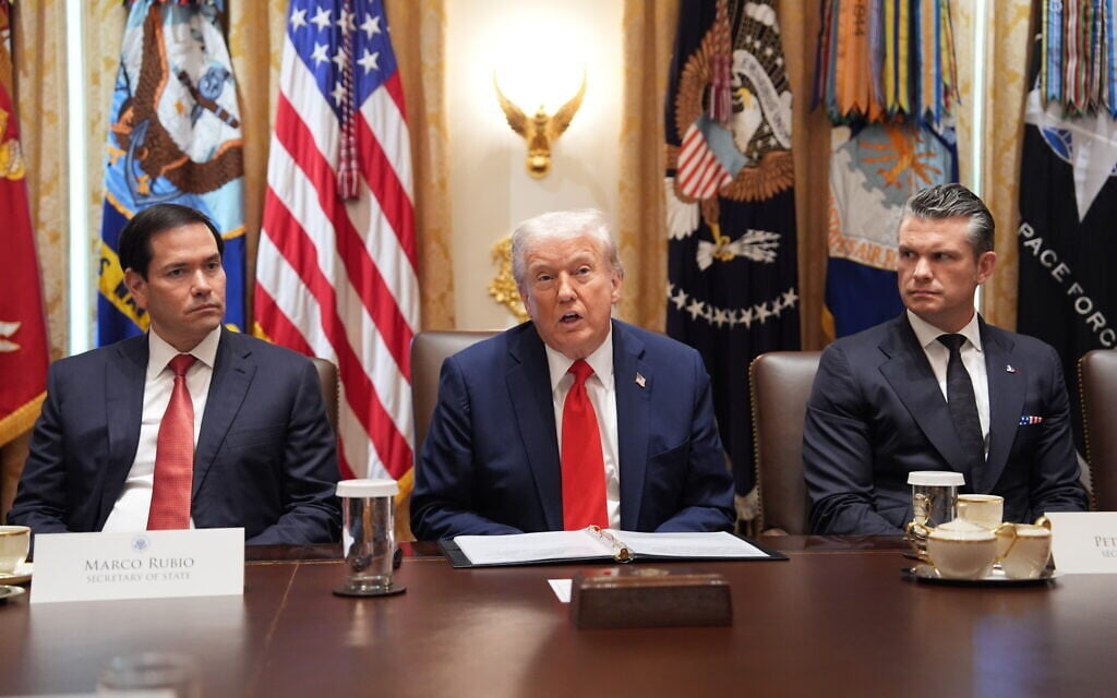 US President Donald Trump speaks during a cabinet meeting at the White House,  October 9, 2025, in Washington, DC, as Secretary of State Marco Rubio, left, and Defense Secretary Pete Hegseth, right, look on. (AP/Evan Vucci)
