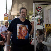 Yossi Tzur stands at the bus stop near where his 17-year-old son, Assaf, was killed in a bus bombing in 2003 that killed 17 people in Haifa, Israel, February 18, 2025. (AP Photo/Maya Alleruzzo, File)