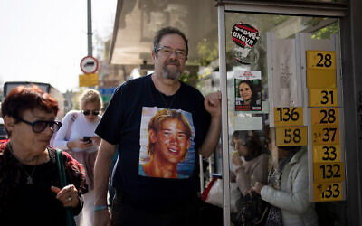Yossi Tzur stands at the bus stop near where his 17-year-old son, Assaf, was killed in a bus bombing in 2003 that killed 17 people in Haifa, Israel, February 18, 2025. (AP Photo/Maya Alleruzzo, File)