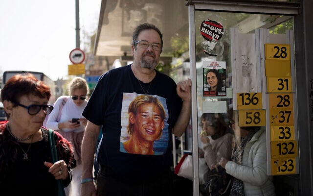 Yossi Tzur stands at the bus stop near where his 17-year-old son, Assaf, was killed in a bus bombing in 2003 that killed 17 people in Haifa, Israel, February 18, 2025. (AP Photo/Maya Alleruzzo, File)