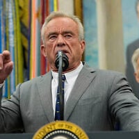 Health and Human Services Secretary Robert F. Kennedy Jr. speaks during an event with President Donald Trump in the Oval Office of the White House, October 10, 2025, in Washington. (AP Photo/Alex Brandon)