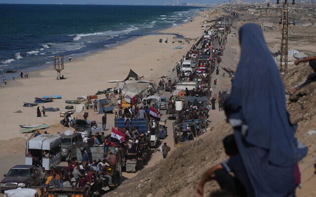 Displaced Palestinians ride on trucks loaded with belongings and wave Egyptian and Palestinian flags as they travel along the coastal road near Wadi Gaza in the central Gaza Strip, moving toward Gaza City, Oct. 11, 2025 (AP Photo/Jehad Alshrafi) Displaced Palestinians ride on trucks loaded with belongings and wave Egyptian and Palestinian flags as they travel along the coastal road near Wadi Gaza in the central Gaza Strip, moving toward Gaza City, Oct. 11, 2025 (AP Photo/Jehad Alshrafi)
