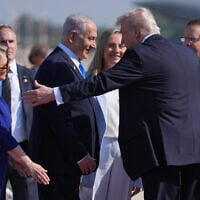 US President Donald Trump greets Prime Minister Benjamin Netanyahu and President Isaac Herzog during an arrival ceremony at Ben Gurion International Airport, October 13, 2025, near Tel Aviv. (AP Photo/Evan Vucci)